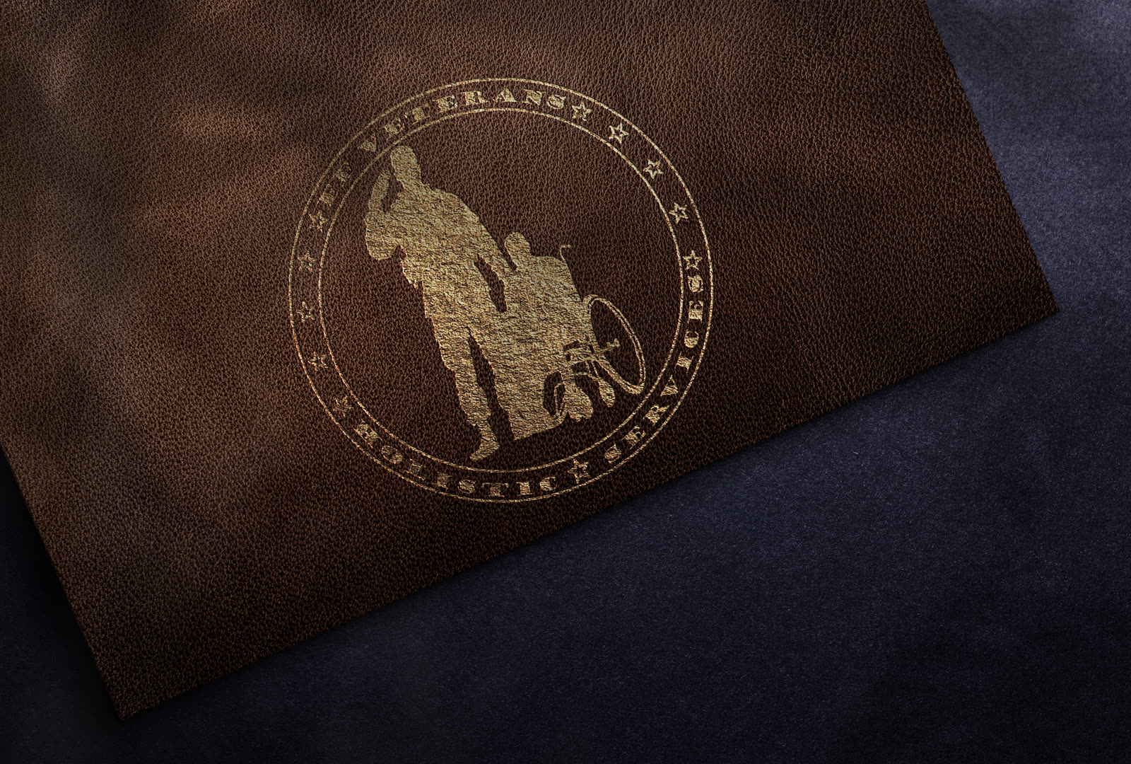 FF Veterans Holistic Services brand mark embossed in leather with foil.